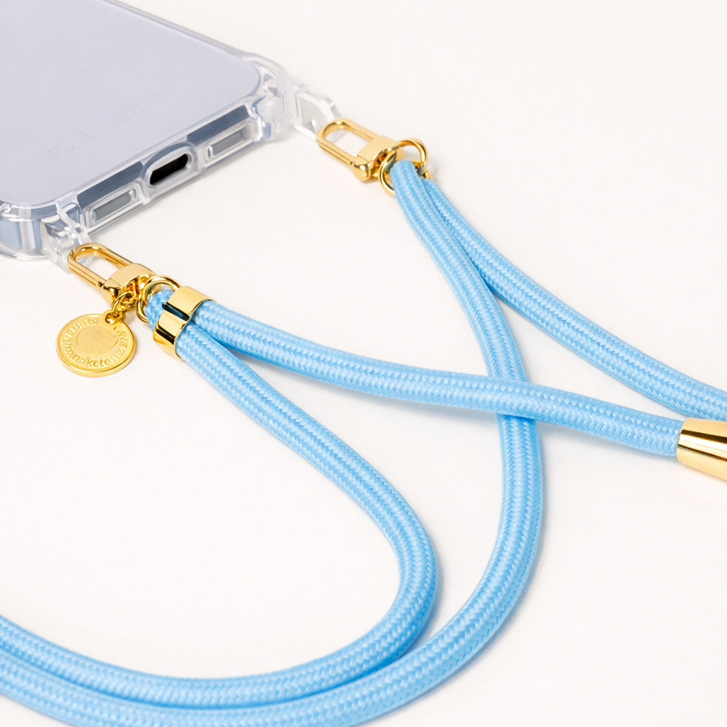 Close-up of light blue Colorful PHONE CORD clasps attached to a clear phone case.