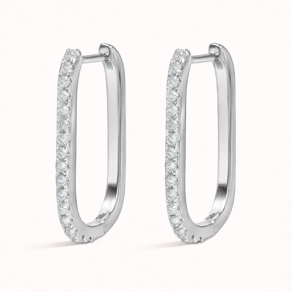 Rendered in silver tone, Fair Game Earrings keep their signature oblong hoop shape with a row of clear pave crystals.