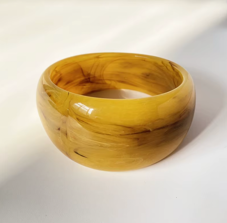 Ivana Acrylic BRACELET chunky bangle in a mustard yellow swirl acrylic, studio close-up on a soft background.