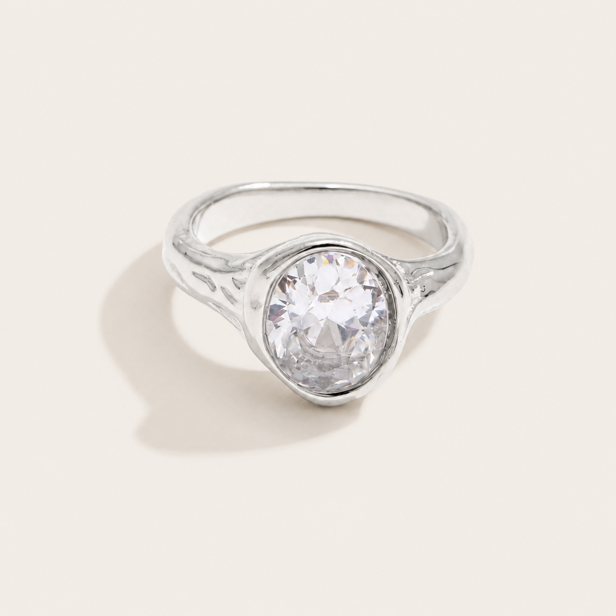 Silver bezel-set ring with a large oval white zirconia stone and a subtly textured band — Folie à Trois Vertex RING