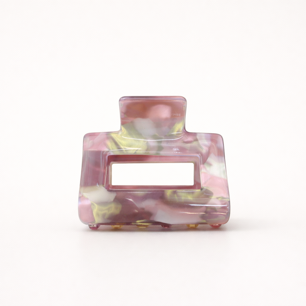 Wren HAIR CLIP rectangular acetate claw clip in a pink, yellow and white marbled pattern, studio shot.
