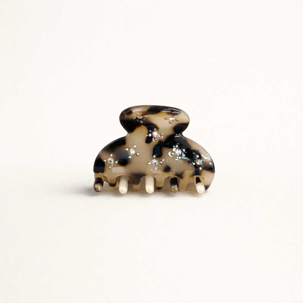 Yumi HAIR CLIP small acetate claw clip in cream and black speckled tortoiseshell with crystal accents, studio shot.