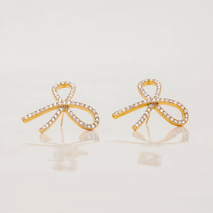 Gold-plated bow-shaped stud earrings embellished with clear crystal stones
