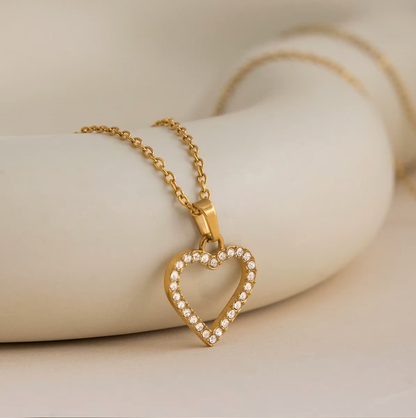 Gold-plated necklace with a delicate chain and an open heart pendant outlined with clear crystal stones
