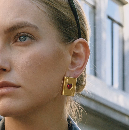 Pair of gold-plated Ace of Hearts stud earrings with rectangular card design and red heart-shaped gemstones