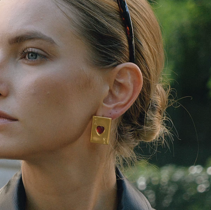 Pair of gold-plated Ace of Hearts stud earrings with rectangular card design and red heart-shaped gemstones