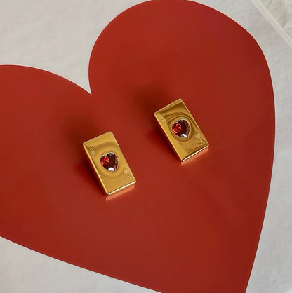 Pair of gold-plated Ace of Hearts stud earrings with rectangular card design and red heart-shaped gemstones