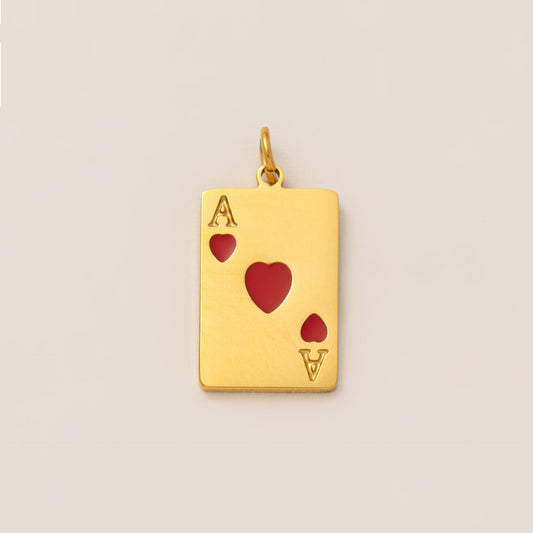 The Ace of Hearts CHARM in gold, a rectangular playing card pendant enameled with red hearts, shown in close-up studio photography.