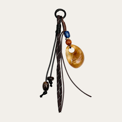 Amber Drop BAG CHARM - braided cord with amber agate donut pendant