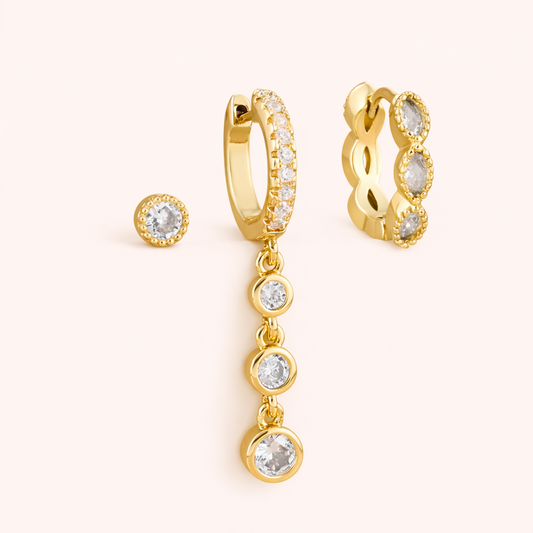 The Amelie SET includes a gold bezel stud, a pave huggie with graduated crystal drops, and a marquise huggie.