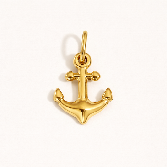 The Anchor CHARM in polished gold, its classic anchor shape shown alone on a plain white studio background.