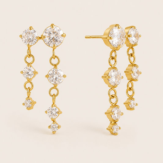 Gold Andromeda EARRINGS drops with three round cubic zirconia stones in a graduated line connected by delicate gold links.