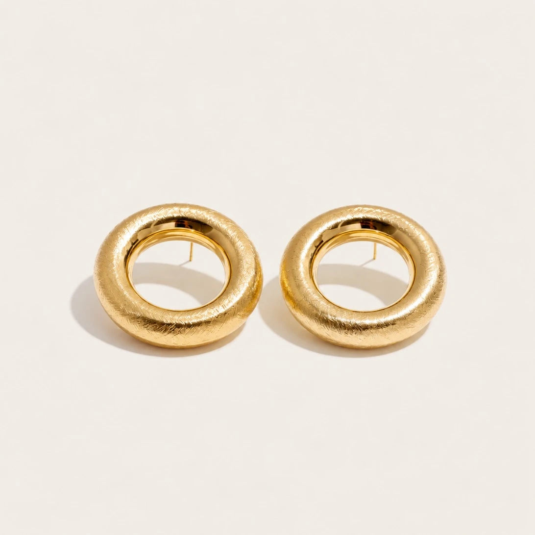 Gold Anello EARRINGS: a pair of bold, rounded ring-shaped earrings with a textured surface — Folie à Trois