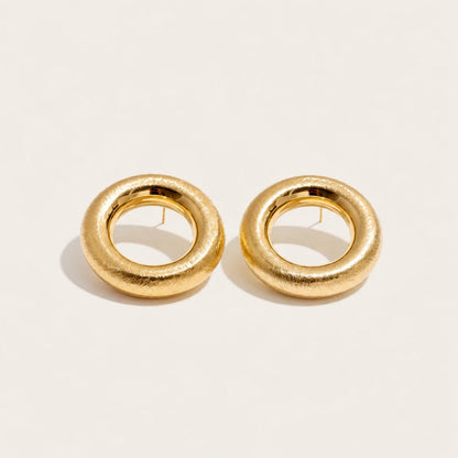 Gold Anello EARRINGS: a pair of bold, rounded ring-shaped earrings with a textured surface — Folie à Trois