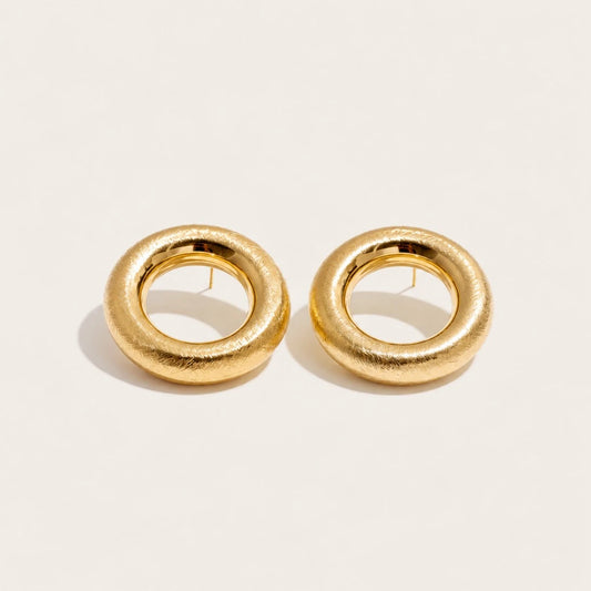 Gold Anello EARRINGS: a pair of bold, rounded ring-shaped earrings with a textured surface — Folie à Trois