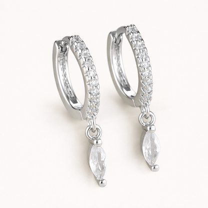 Anette Earrings in silver with clear crystals, showing the pave hoop and marquise crystal drop design.