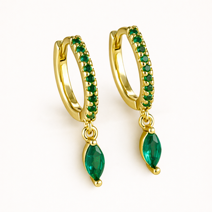 Anette Earrings in gold with emerald-green crystals, showing the same pave hoop and marquise drop design.