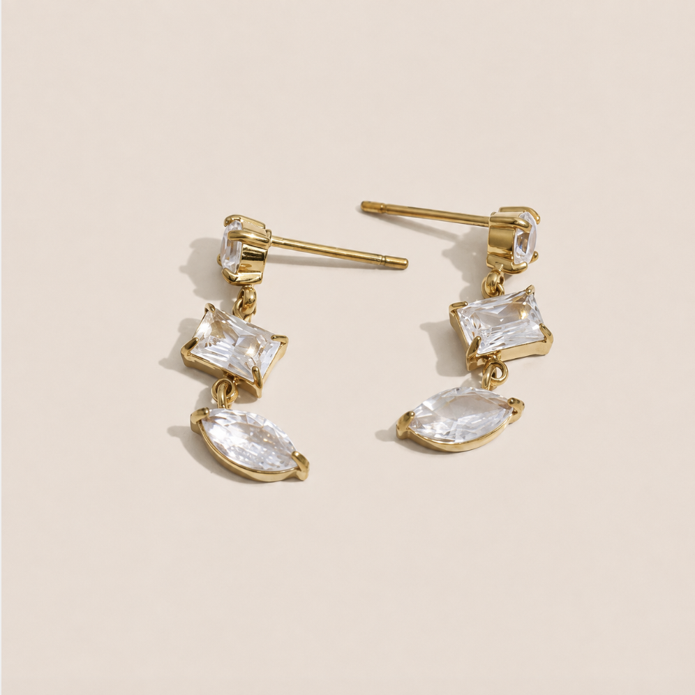 Gold drop earring with a kite-cut and marquise-cut white zirconia stone pairing — Folie à Trois Angles EARRINGS.