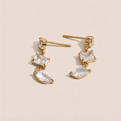 Gold drop earring with a kite-cut and marquise-cut white zirconia stone pairing — Folie à Trois Angles EARRINGS.