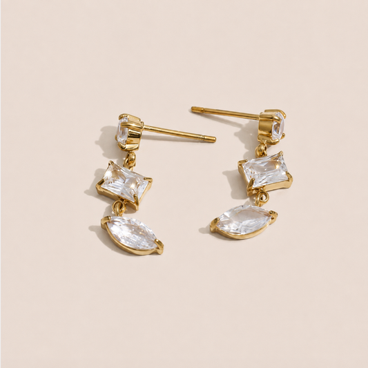 Gold drop earring with a kite-cut and marquise-cut white zirconia stone pairing — Folie à Trois Angles EARRINGS.