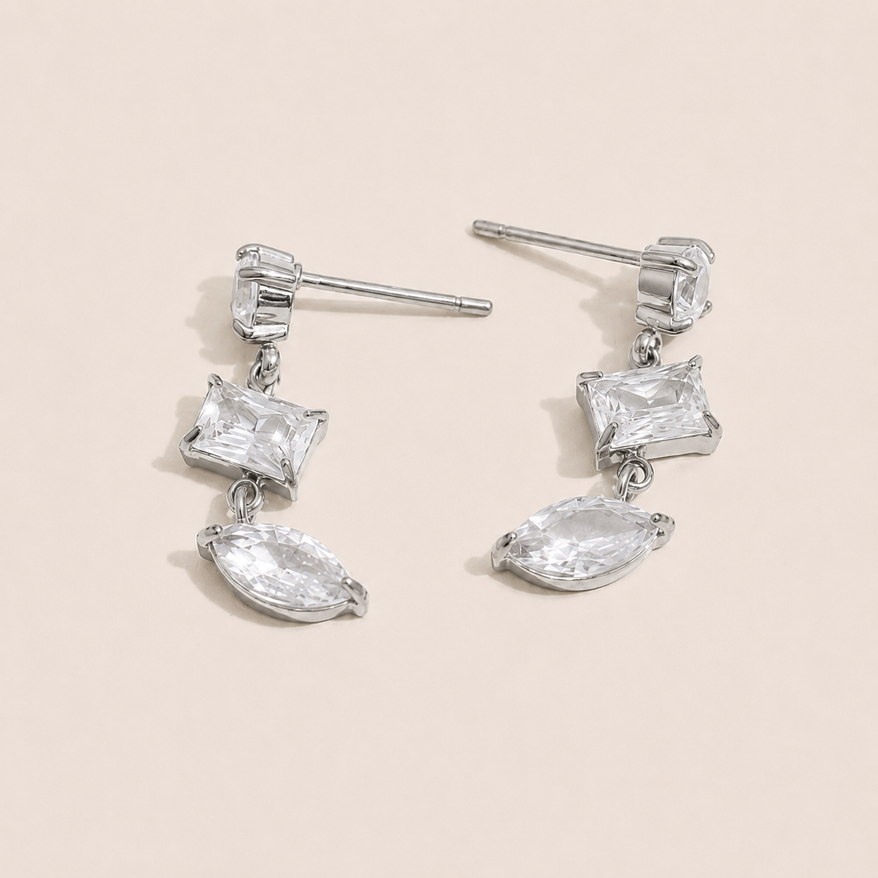Silver drop earring with a kite-cut and marquise-cut white zirconia stone pairing — Folie à Trois Angles EARRINGS.