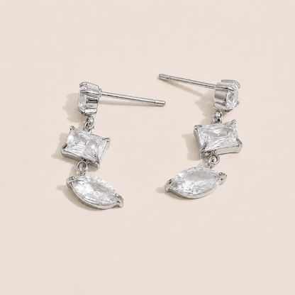 Silver drop earring with a kite-cut and marquise-cut white zirconia stone pairing — Folie à Trois Angles EARRINGS.