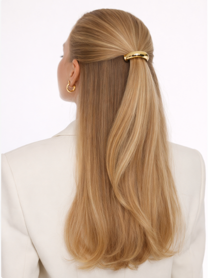 Anita Hair Tie worn in a half-up style, gold bead accent on straight blonde hair, cream blazer.