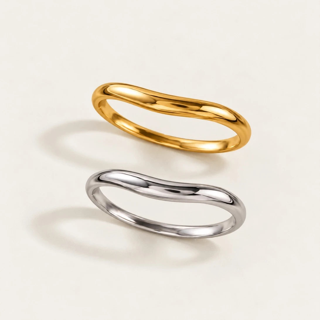 Gold and silver-tone Arco BRACELETS, slim bangles with a gentle curved arch, seen from above — Folie à Trois wholesale