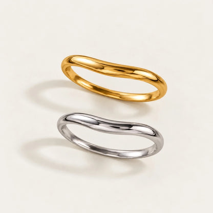 Gold and silver-tone Arco BRACELETS, slim bangles with a gentle curved arch, seen from above — Folie à Trois wholesale