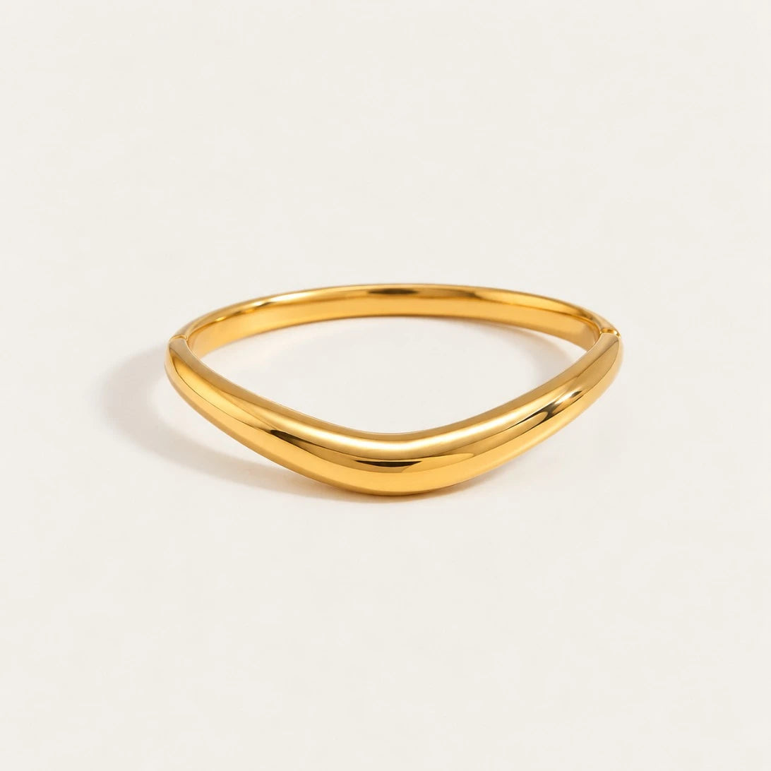 Gold Arco BRACELET: a slim, polished bangle with a soft curved arch — Folie à Trois wholesale jewelry