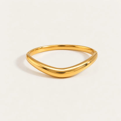 Gold Arco BRACELET: a slim, polished bangle with a soft curved arch — Folie à Trois wholesale jewelry
