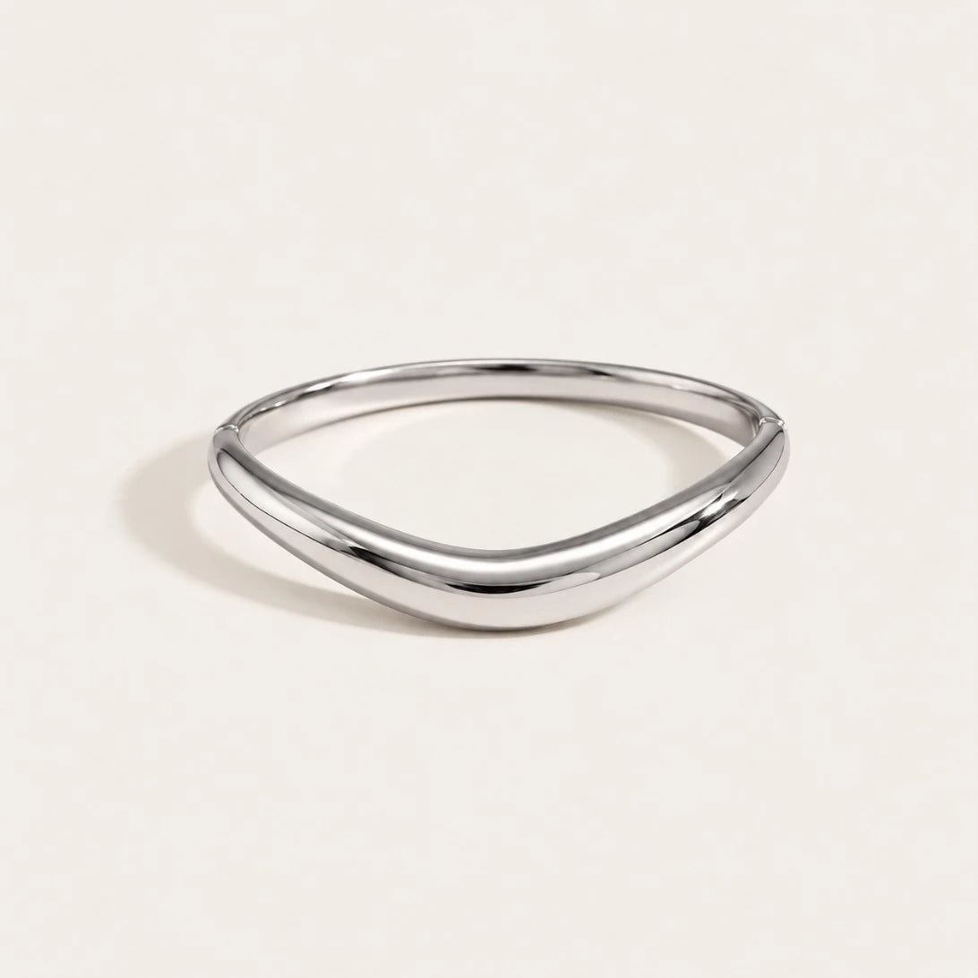 Silver-tone Arco BRACELET: a slim, polished bangle with a soft curved arch — Folie à Trois wholesale jewelry