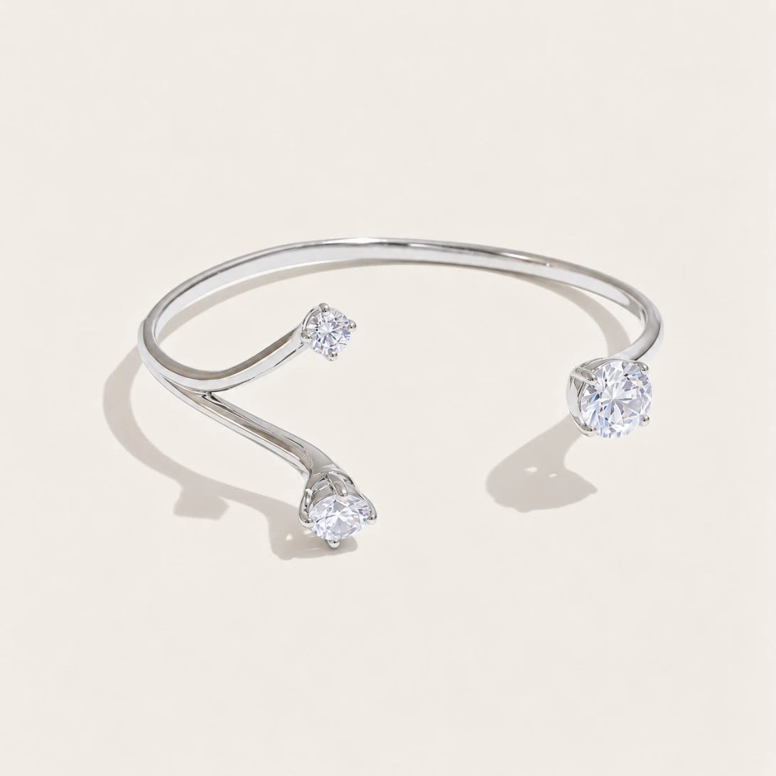 Silver-tone Aurelia BRACELET: an open cuff bangle with a sparkling white zirconia at each end — Folie à Trois