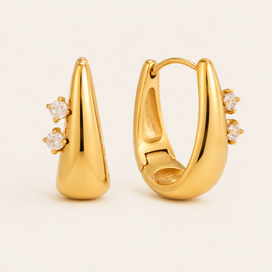 Gold Avaline EARRINGS teardrop hoops with two round cubic zirconia stones set along one edge of each hoop.