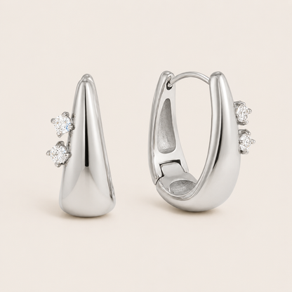 Silver Avaline EARRINGS teardrop hoops with two round cubic zirconia stones set along one edge of each hoop.