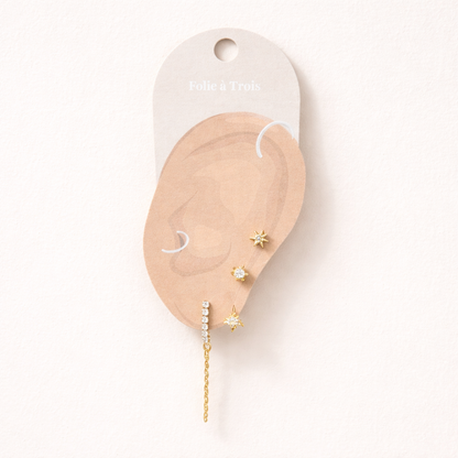 Bianca Set displayed on a Folie a Trois ear-shaped card, arranging the star stud, flower drop, and chain bar for styling.