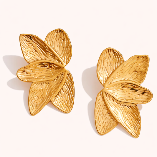 Bloom Earrings in gold, textured petal-shaped studs layered like a blooming flower, shown as a pair.