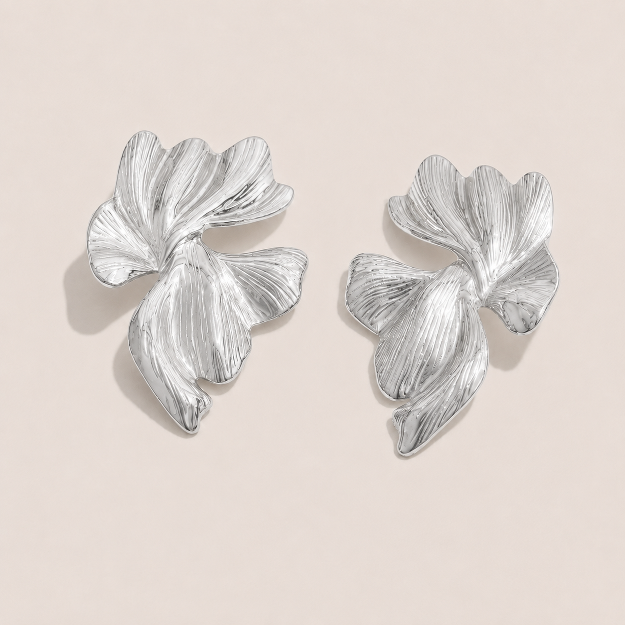 Silver textured leaf-petal stud earring with sculptural, veined ridges — Folie à Trois Botanica EARRINGS.