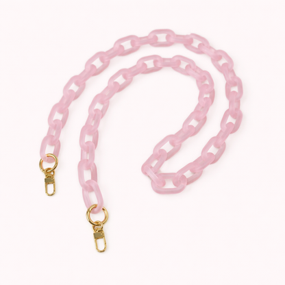 Soft pink frosted acrylic Bubble Links phone chain coiled flat with gold-tone clasp hardware.