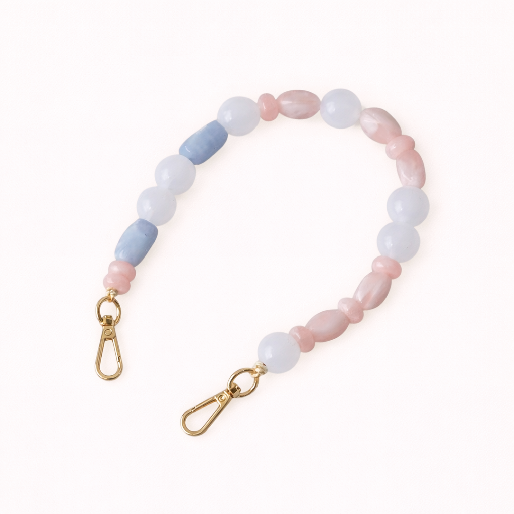 Blue and pink stone beaded Celia short phone strap coiled flat with gold-tone clasp ends.