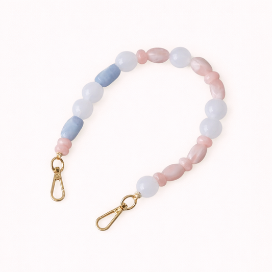 Blue and pink stone beaded Celia short phone strap coiled flat with gold-tone clasp ends.