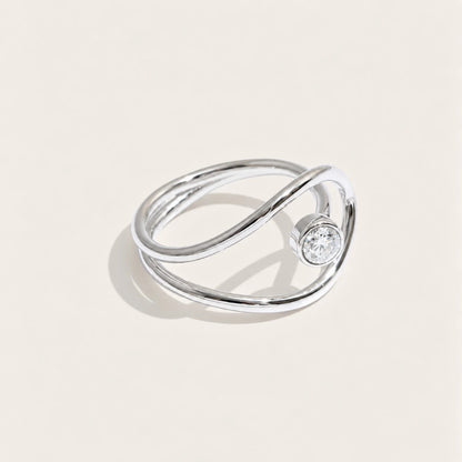 Silver-tone Cercle RING: a slim band looping into an open circle that frames a white zirconia stone — Folie à Trois