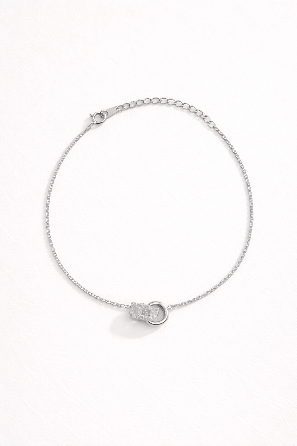 Chasing Highs BRACELET silver chain bracelet with a pave crystal ring charm centerpiece, studio flat-lay on white.