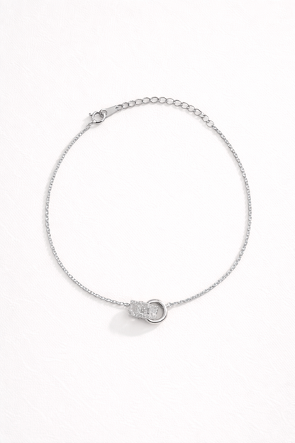 Chasing Highs BRACELET silver chain bracelet with a pave crystal ring charm centerpiece, studio flat-lay on white.
