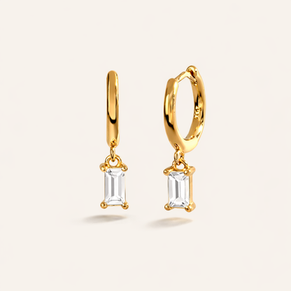 Classic Drop Earrings in gold with clear crystals, showing the smooth hoop and baguette-cut crystal drop.