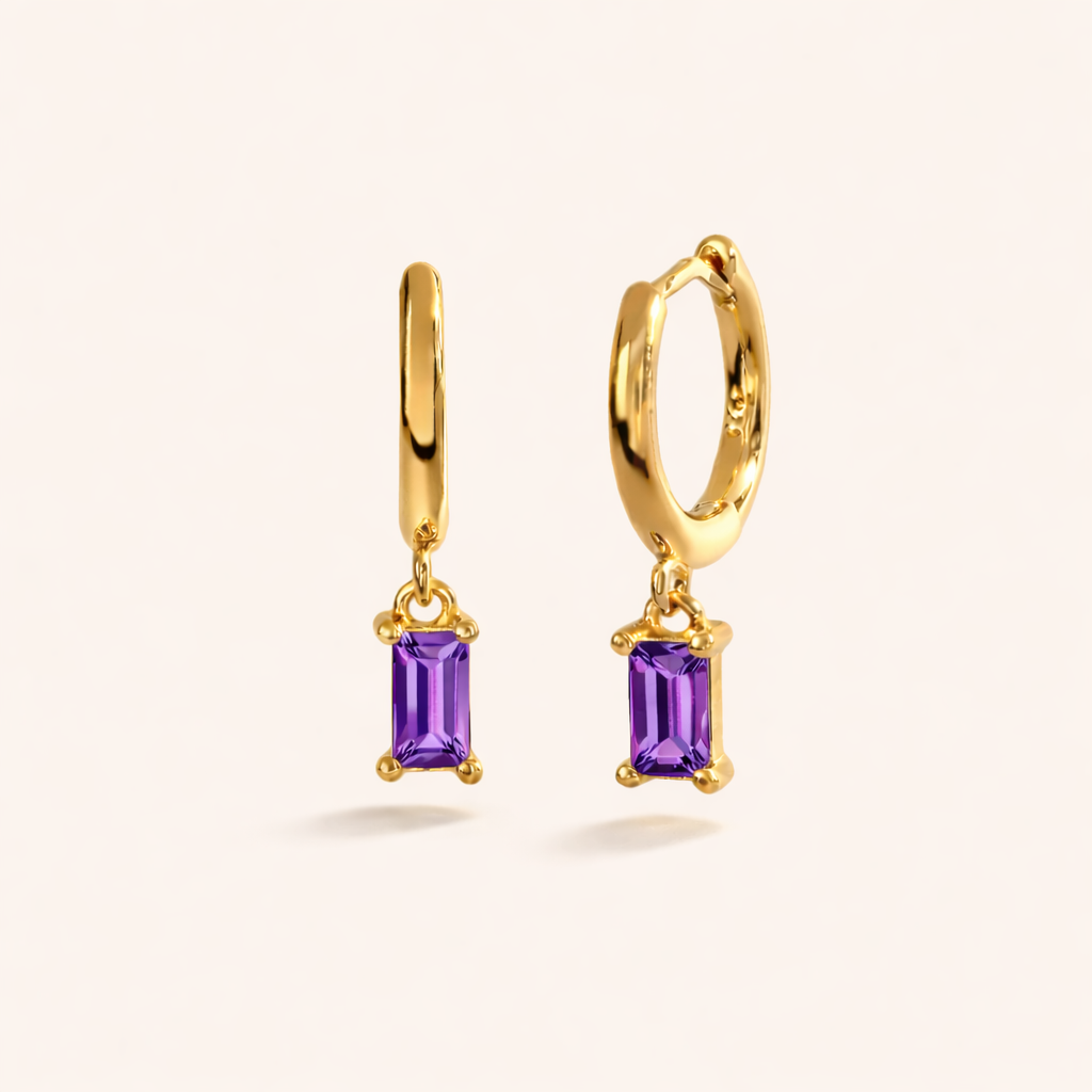 Classic Drop Earrings in gold with amethyst-purple crystals, the smooth hoop dropping a baguette-cut stone.