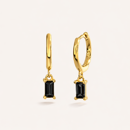 Classic Drop Earrings in gold with black crystals, showing the smooth hoop and baguette-cut crystal drop.