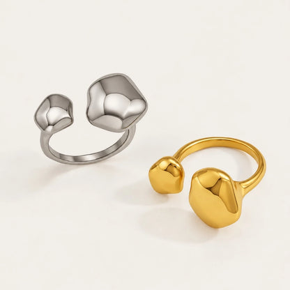Gold and silver-tone Cloud RINGS: open adjustable rings with two smooth pebble-shaped ends — Folie à Trois wholesale