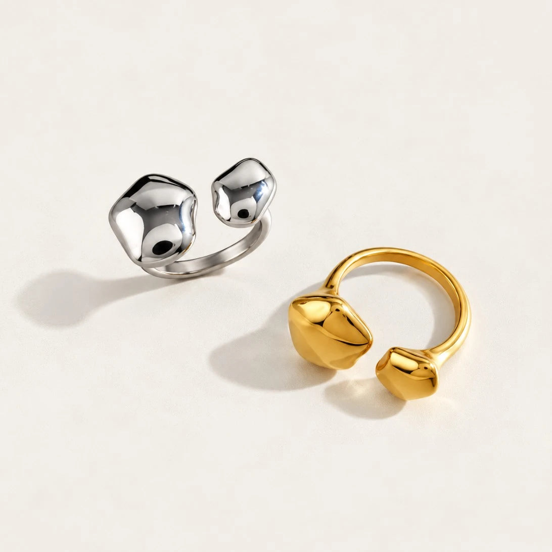 Silver-tone and gold Cloud RINGS side by side, open bands with sculptural pebble ends — Folie à Trois wholesale jewelry