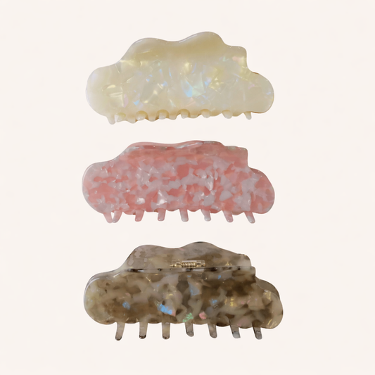 Three Cloudy Day HAIR CLIP cloud-shaped claw clips in cream, pink and grey marbled acetate, on a cream background.